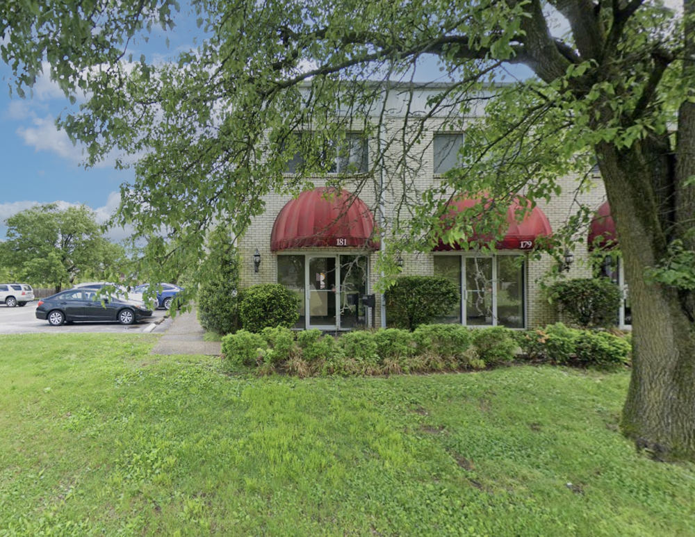 Image of the building and parking lot